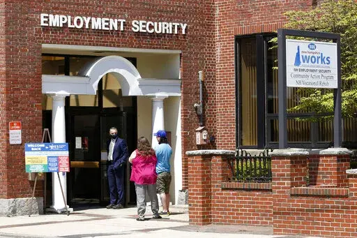Job seekers line up outside the New Hampshire Works employment security job center, Monday, May 10, 2021, in Manchester, N.H. More Americans applied for jobless aid last week but the total number of Americans collecting unemployment remains at a five-decade low. Applications for unemployment benefits rose by 27,000 to 229,000 for the week ending June 4, the most since mid-January, the Labor Department reported Thursday, June 9, 2022. (AP Photo/Mary Schwalm, File)