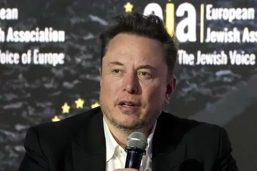 Elon Musk addresses the European Jewish Association's conference, in Krakow, Poland, Monday, Jan. 22, 2024. Musk is suing OpenAI and its CEO Sam Altman, Thursday, Feb. 29, over what he says is a betrayal of the ChatGPT maker's founding aims of benefiting humanity rather than pursuing profits. (AP Photo/Czarek Sokolowski, File)