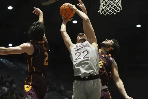 Mississippi State forward RJ Melendez (22) attempts a layup past a block attempt by Central Michigan center Hunter Harding (12) during the first half of an NCAA college basketball game, Tuesday, Dec. 17, 2024, in Jackson, Miss. (AP Photo/Rogelio V. Solis)