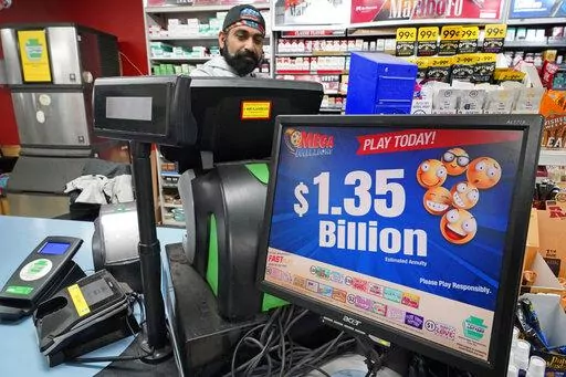 A Mega Million sign displays the estimated jackpot of $1.35 Billion at the Cranberry Super Mini Mart in Cranberry, Pa., Jan. 12, 2023. The winner of a $1.35 billion Mega Millions jackpot has come forward to collect the prize. The Maine State Lottery announced Wednesday, Feb. 22, that the winner chose to remain anonymous and collect the cash option through a limited liability company instead of receiving the full amount in payments over time. (AP Photo/Gene J. Puskar, File)