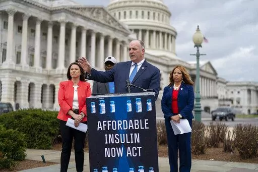 From left, Rep. Angie Craig, D-Minn., House Majority Whip James Clyburn, D-S.C., Rep. Dan Kildee, D-Mich., Rep. Lucy McBath, Ga., talk about their legislation aimed at capping the price of insulin, at the Capitol in Washington, Thursday, March 31, 2022. The bill would keep consumers' out-of-pocket costs at no more than $35 per month. (AP Photo/J. Scott Applewhite)