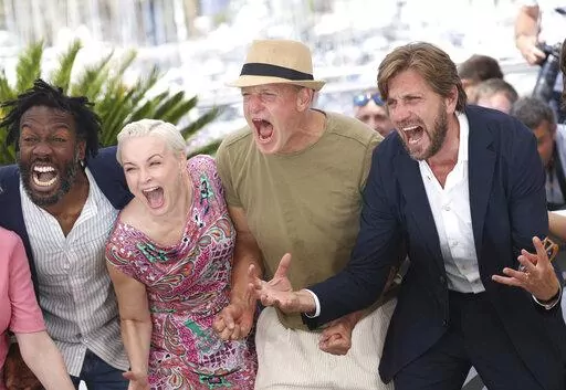 Jean-Christophe Folly, from left, Vicki Berlin, Woody Harrelson, and Ruben Östlund pose for photographers at the photo call for the film 'Triangle of Sadness' at the 75th international film festival, Cannes, southern France, Sunday, May 22, 2022. (Photo by Vianney Le Caer/Invision/AP)