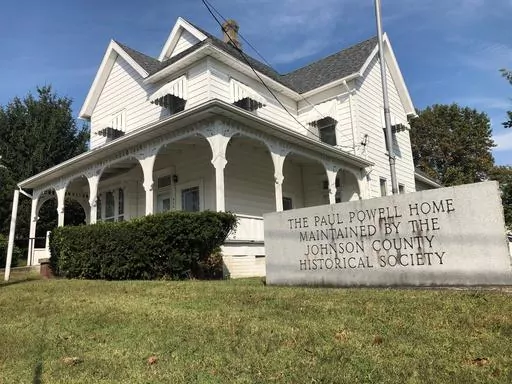 A sign marks he Paul Powell Home and Museum, Oct. 8, 2020 photo in Vienna, Ill. For more than half a century, a Powell-established $250,000 trust sustained his legacy, for better or worse. But the account that maintained his birthplace as a museum will soon run dry. (AP Photo/John O'Connor, File)