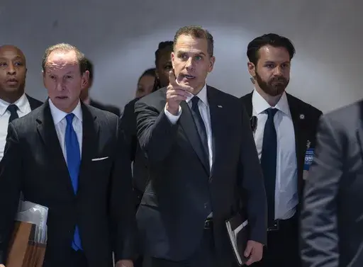Hunter Biden, son of President Joe Biden, with attorney Abbe Lowell, left, leaves after a closed-door deposition in the Republican-led investigation into the Biden family, on Capitol Hill in Washington, Wednesday, Feb. 28, 2024. (AP Photo/J. Scott Applewhite)