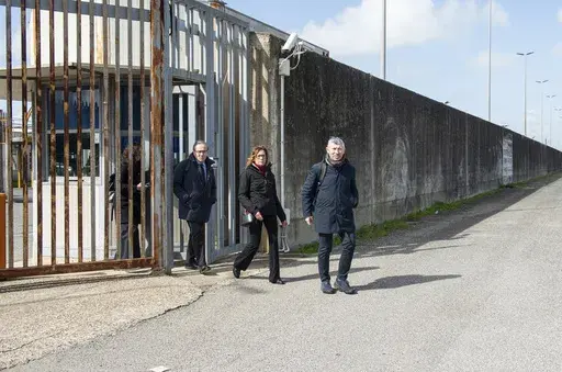 From left, Italian Senators Walter Verini, Ilaria Cucchi, and Ivan Scalfarotto exit a migrants repatriation center in Ponte Galeria, in the outskirts of Rome after a surprise visit, Wednesday, March 6, 2024. Pressure is building on Italy authorities to close the notorious migrant detention center of Ponte Galeria where Ousmane Sylla, a Guinean migrant, hung himself last month and visiting opposition senators described inhuman conditions for people ordered to leave Italy but still awaiting repatr