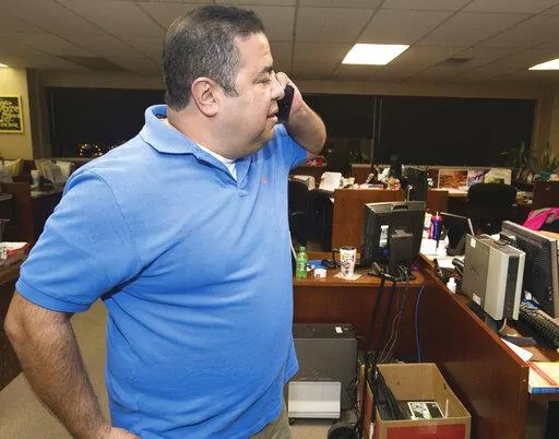Pueblo County Clerk Gilbert “Bo” Ortiz checks the status of voting machines that apparently failed to work correctly, causing long delays in election results being released on Nov, 8, 2016 in Pueblo, Colo. In Pueblo County, election officials are preparing for every possibility during the November general election. Ortiz oversees elections as the clerk and recorder in Pueblo County, which Donald Trump narrowly won in 2016 but lost four years later. (Chris McLean/The Pueblo Chieftain via AP, 