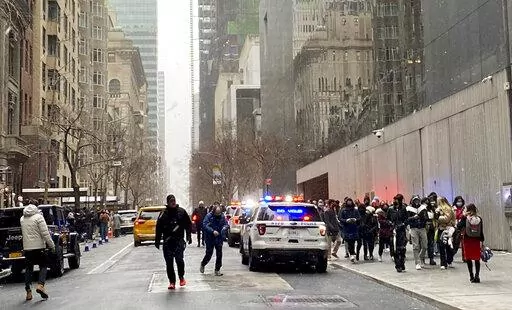 In this photo from a social media post by Scott Cowdrey, people are evacuated from the Museum of Modern Art where a stabbing occurred, Saturday, March 12, 2022, in New York. Police said two people were stabbed inside MoMA and in stable condition at Bellevue Hospital. (Scott Cowdrey via AP)