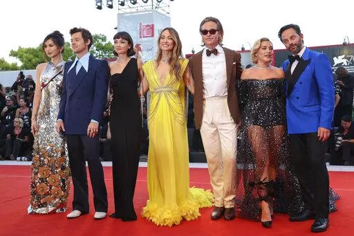 Gemma Chan, from left, Harry Styles, Sydney Chandler, director Olivia Wilde, Chris Pine, Florence Pugh and Nick Kroll pose for photographers upon arrival at the premiere of the film 'Don't Worry Darling' during the 79th edition of the Venice Film Festival in Venice, Italy, Monday, Sept. 5, 2022. (Photo by Vianney Le Caer/Invision/AP)