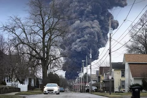 A black plume rises over East Palestine, Ohio, as a result of a controlled detonation of a portion of the derailed Norfolk Southern trains, Feb. 6, 2023. (AP Photo/Gene J. Puskar, File)