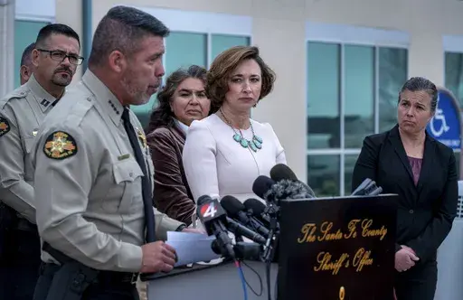 Santa Fe County Sheriff, Adan Mendoza, second from left, Dr. Heather Jarrell, chief medical investigator for the New Mexico Office of the Medical Investigator, center, and Dr. Erin Phipps, New Mexico State Veterinarian with the New Mexico Department of Health, hold a news conference to talk about the cause of death for Gene Hackman and his wife Betsy Arakawa in Santa Fe, N.M. (Eddie Moore/The Albuquerque Journal via AP)
