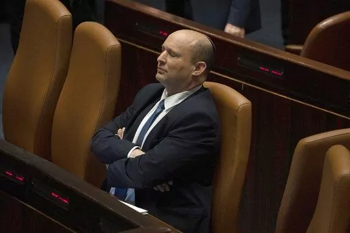 Israeli Prime Minister Naftali Bennett pauses during the opening of the summer session of the Knesset, Israel's parliament, in Jerusalem, Monday, May 9, 2022. Less than a year after taking office, Bennett has lost his parliamentary majority, his own party is crumbling and a key governing partner has suspended cooperation with the coalition. That has set the stage for a possible attempt by the opposition, led by former Prime Minister Benjamin Netanyahu, to topple the government later this week. (