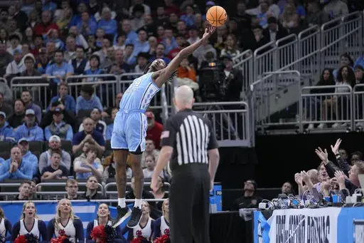North Carolina forward Jae'Lyn Withers (24) attempts to catch an overthrown pass during the first half in the first round of the NCAA college basketball tournament against Mississippi, Friday, March 21, 2025, in Milwaukee, Wis. (AP Photo/Kayla Wolf)