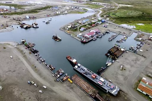 This photo provided by the City of Nome shows the inner harbor of the Port of Nome, Alaska, on Aug. 11, 2017, where goods at that arrive at the port are then prepared for shipment to villages throughout the region. Shipping lanes that were once clogged with ice for much of the year along Alaska's western and northern coasts have relented thanks to global warming, and the nation's first deep water Arctic port should be operational in Nome by the end of the decade. (Nome Harbormaster Lucas Stotts/