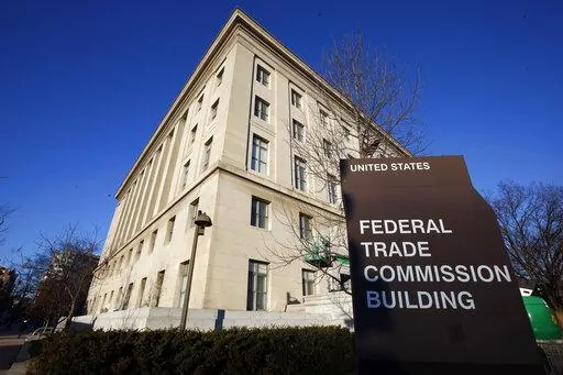 The Federal Trade Commission building in Washington is pictured on Jan. 28, 2015. The Federal Trade Commission is proposing a new rule that would prevent employers from imposing noncompete clauses on their workers. (AP Photo/Alex Brandon, File)