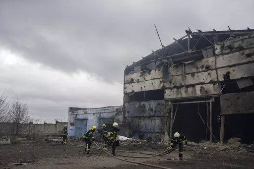 Firefighters try to extinguish the fire at a damaged factory following a Russian bombing in Kramatorsk, Ukraine, Thursday, April 14, 2022. (AP Photo/Petros Giannakouris)