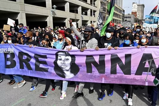 Tamika Palmer, center, the mother of Breonna Taylor, leads a march through the streets of downtown Louisville on the one year anniversary of Taylor's death on March 13, 2021, in Louisville, Ky. Questioning of potential jurors begins Tuesday, Feb. 1, 2022, for the trial of a former Kentucky police officer involved in a botched raid that killed Taylor, a 26-year-old Louisville emergency medical technician. Brett Hankison is standing trial on three counts of wanton endangerment for allegedly firing