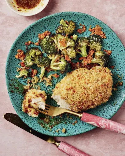 This image released by Union Square shows a recipe for panko honey mustard chicken from the cookbook “What to Cook When You Don’t Feel Like Cooking” by Caroline Chambers. (Eva Kolenko/Union Square via AP)