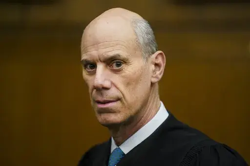 U.S. District Judge James Boasberg, chief judge of the United States District Court for the District of Columbia, stands for a portrait at E. Barrett Prettyman Federal Courthouse in Washington, March 16, 2023. (Carolyn Van Houten/The Washington Post via AP, File)