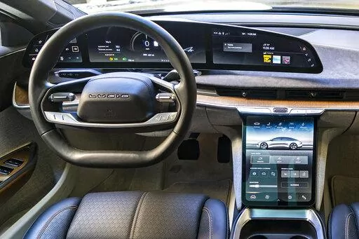 This photo provided by Edmunds shows the interior of the 2022 Lucid Air, an electric vehicle whose software allows it to add features via over-the-air updates. (Rex Tokeshi-Torres/Courtesy of Edmunds via AP)