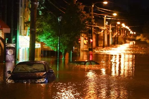 The Manayunk neighborhood in Philadelphia is flooded Thursday, Sept. 2, 2021, in the aftermath of downpours and high winds from the remnants of Hurricane Ida. La Nina, the natural but potent weather event linked to more drought and wildfires in the western United States and more Atlantic hurricanes, is becoming the nation’s unwanted weather guest and meteorologists said the West’s megadrought won’t go away until La Nina does. (AP Photo/Matt Rourke, File)