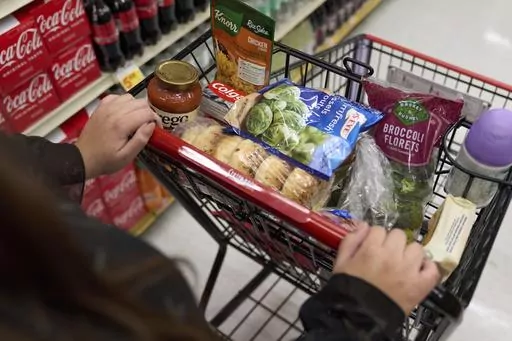 Jaqueline Benitez, who depends on California's SNAP benefits to help pay for food, shops for groceries at a supermarket in Bellflower, Calif., on Feb. 13, 2023. (AP Photo/Allison Dinner, file)
