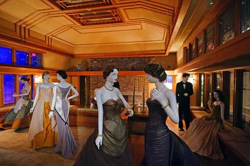 A scene staged by film director Martin Scorsese featuring fashions by designer Charles James and a room by architect Frank Lloyd Wright is displayed as part of the Met Museum Costume Institute's exhibit "In America: A Lexicon of Fashion," Saturday, April 30, 2022, in New York. (Photo by Charles Sykes/Invision/AP)