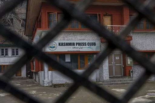 Kashmir Press Club building is pictured through a closed gate after it was sealed by authorities in Srinagar, Indian controlled Kashmir, Tuesday, Jan. 18, 2022. Last week, a few journalists supportive of the Indian government, with assistance from armed police, took control of the region’s only independent press club. Authorities shut it down a day later, drawing sharp criticism from journalist bodies. Reporters Without Borders called it an “undeclared coup” and said the region is “stead