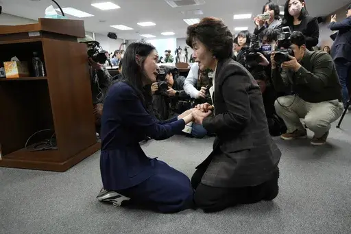 Truth and Reconciliation Commission Chairperson Park Sun Young, right, comforts adoptee Yooree Kim during a press conference in Seoul, South Korea, Wednesday, March 26, 2025. (AP Photo/Ahn Young-joon)