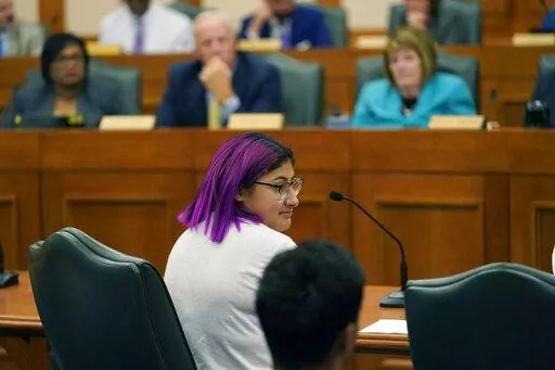 Jazmin Cazares, center, whose young sister Jacklyn was was one of 19 children killed at Robb Elementary School, speaks before a hearing at the state capitol, Thursday, June 23, 2022, in Austin, Texas. Cazares pleaded for Texas lawmakers to pass gun safety legislation and questioned why so many security measures failed. (AP Photo/Eric Gay)