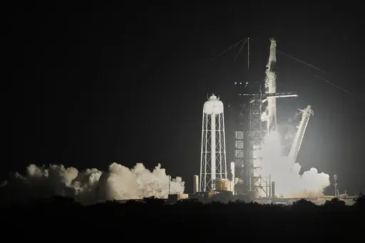 A SpaceX Falcon 9 rocket with a commercial crew of four lifts off from pad 39A at the Kennedy Space Center in Cape Canaveral, Fla., Monday, March 31, 2025. (AP Photo/John Raoux)
