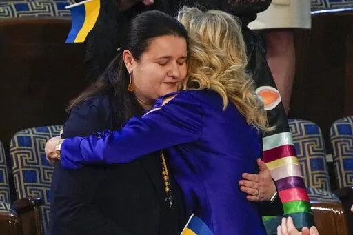 Ukraine Ambassador to the United States, Oksana Markarova, gets a hug from first lady Jill Biden during President Joe Biden's first State of the Union address to a joint session of Congress, at the Capitol in Washington, Tuesday, March 1, 2022. (AP Photo/J. Scott Applewhite, Pool)