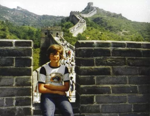 This photo provided by Ted Anthony shows him at the age of 11 sitting on a section of the Great Wall outside Beijing in fall 1979. The photo was taken by his father Edward Mason Anthony. For one 11-year-old American boy, Richard Nixon's trip to China changed almost everything. In 1979, Ted Anthony was part of the earliest wave of American families to come to Beijing after relations were established thanks to the 1972 meeting between Nixon and Mao Zedong. Now an Associated Press journalist, he sa