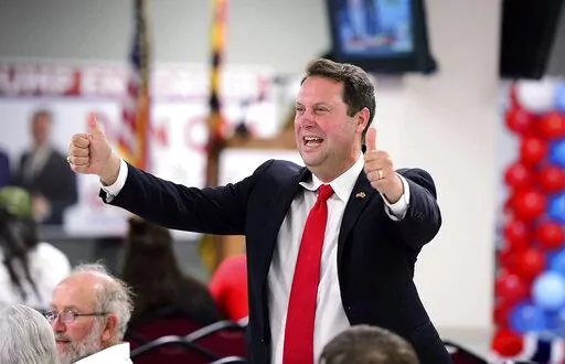 Maryland State Delegate Dan Cox gives a thumbs up as he enters a victory party after winning the Republican primary for Maryland governor, Tuesday evening, July 19, 2022, in Emmitsburg, Md. (Ric Dugan/The Frederick News-Post via AP)