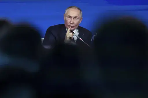 Russian President Vladimir Putin gestures as he answers to a question during a meeting with foreign policy experts at the Valdai Discussion Club in the Black Sea resort of Sochi, Russia, Thursday, Nov. 7, 2024. (Maxim Shipenkov/Pool Photo via AP)