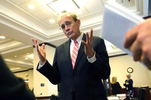 Mississippi Lt. Gov. Delbert Hosemann, a Republican, speaks with reporters, Wednesday, Dec. 6, 2023, after a meeting of the Joint Legislative Budget Committee in Jackson, Miss. Hosemann says the Republican-controlled Mississippi Legislature is watching economic trends as it considers how to set a state spending plan for the year that begins July 1, 2024. (AP Photo/Rogelio V. Solis)