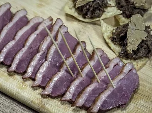 Samples of foie gras delicacy from ducks farmed at Hudson Valley Foie Gras duck farm are displayed on July 18, 2019, in Ferndale, N.Y. New York City’s ban on the sale of foie gras, already delayed by a court challenge, has now been found in violation of state agricultural law. (AP Photo/Bebeto Matthews, File)