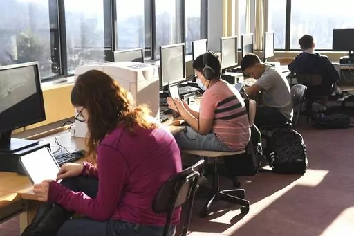 Students work in the library during homeroom at D.H.H. Lengel Middle School in Pottsville, Pa., March 15, 2022. Nearly nine out of 10 parents believe their child is performing at grade level despite standardized tests showing far fewer students are on track, according to a poll released Wednesday, Nov. 15, 2023, by Gallup and the nonprofit Learning Heroes. (Lindsey Shuey/Republican-Herald via AP, File)