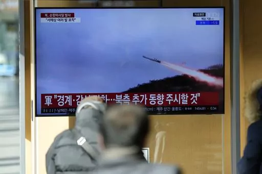 A TV screen shows a report of North Korea's cruise missiles with file footage during a news program at the Seoul Railway Station in Seoul, South Korea, Wednesday, Jan. 24, 2024. South Korea's military says North Korea fired several cruise missiles into waters off its western coast, adding to a provocative run of weapons demonstrations in the face of deepening nuclear tensions with the United States, South Korea and Japan. (AP Photo/Lee Jin-man)