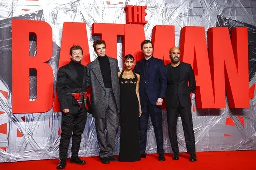 Andy Serkis, from left, Robert Pattinson, Zoe Kravitz, Paul Dano and Jeffrey Wright pose for photographers upon arrival for the screening of the film 'The Batman' in London Wednesday, Feb. 23, 2022. (Photo by Joel C Ryan/Invision/AP)