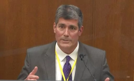 In this image from video, Dr. Andrew Baker, Hennepin County Medical Examiner, testifies in the trial of former Minneapolis police Officer Derek Chauvin in Minneapolis, Minn. Baker, the chief medical examiner who ruled George Floyd’s death a homicide will return to the stand Tuesday, Feb. 1, 2022, at the trial of three former Minneapolis police officers charged with violating Floyd’s civil rights. (Court TV via AP, Pool, File)