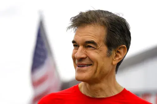 Mehmet Oz, a Republican candidate for U.S. Senate in Pennsylvania, visits a car show in Carlisle, Pa., Saturday, May 14, 2022. (AP Photo/Matt Rourke)