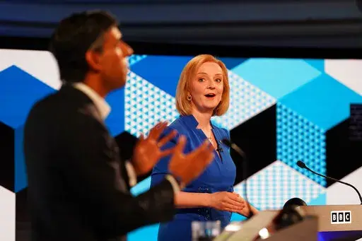 Liz Truss, right, and Rishi Sunak take part in the BBC Conservative Party leadership debate in Stoke-on-Trent, England, Monday July 25, 2022. Britain’s next prime minister will take office amid turmoil: galloping inflation, a war in Ukraine, souring relations with China and a changing climate. But not all those issues are getting equal attention as Foreign Secretary Truss and former Treasury chief Sunak vie for the votes of about 180,000 Conservative Party members. (Jacob King/Pool via AP, Fil