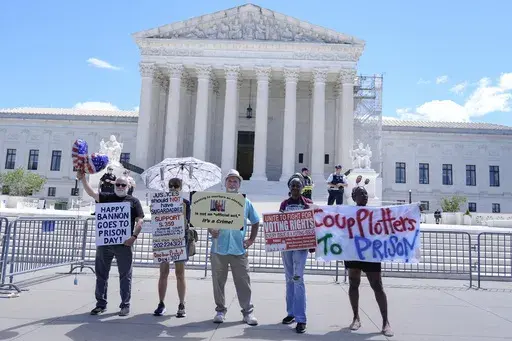People protest outside the Supreme Court Monday, July 1, 2024, in Washington. The Supreme Court displayed its own power as it ended a hugely significant term with a 6-3 decision that in turn broadened presidential power by saying former presidents had widespread immunity from criminal prosecution for acts undertaken while they were in office. (AP Photo/Mariam Zuhaib)