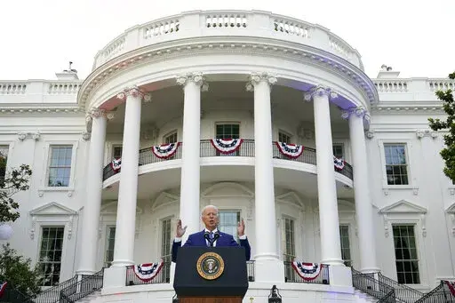 President Joe Biden speaks during an Independence Day celebration on the South Lawn of the White House, July 4, 2021, in Washington. Last Fourth of July, Biden gathered hundreds of people outside the White House for an event that would have been unthinkable for many Americans the previous year. With the coronavirus in retreat, they ate hamburgers and watched fireworks over the National Mall. (AP Photo/Patrick Semansky, File)