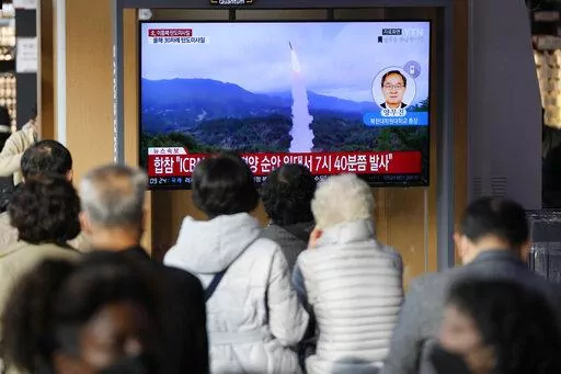 A TV screen showing a news program reporting about North Korea's missile launch with file footage is seen at the Seoul Railway Station in Seoul, South Korea, Thursday, Nov. 3, 2022. North Korea continued its barrage of weapons tests on Thursday, firing at least three missiles including a suspected intercontinental ballistic missile that forced the Japanese government to issue evacuation alerts and temporarily halt trains.  (AP Photo/Lee Jin-man)