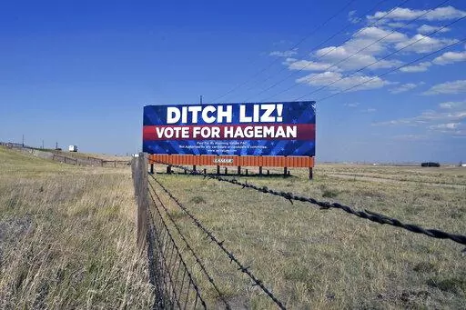 A billboard outside Cheyenne, Wyo., on July 19, 2022, calls on voters to cast their ballots for Harriet Hageman, who is running against incumbent Rep. Liz Cheney, R-Wyo., in the Republican primary election Aug. 16. Rep. Cheney is in the political fight of her life. Wyoming's congresswoman since 2016 is facing a Donald Trump-backed opponent, attorney Harriet Hageman, in the state's upcoming Republican primary. (AP Photo/Thomas Peipert)