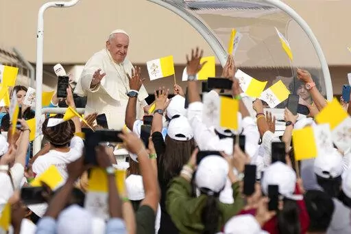 Pope Francis arrives to celebrate mass at the Bahrain National Stadium in Riffa, Bahrain, Saturday, Nov. 5, 2022. Pope Francis is making the November 3-6 visit to participate in a government-sponsored conference on East-West dialogue and to minister to Bahrain's tiny Catholic community, part of his effort to pursue dialogue with the Muslim world. (AP Photo/Alessandra Tarantino)