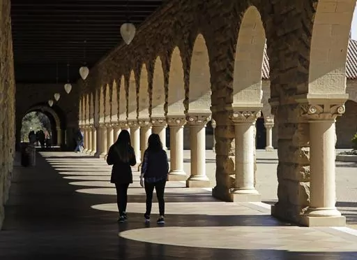In this March 14, 2019, file photo students walk on the Stanford University campus in Santa Clara, Calif. A new study from the State Department and the Institute of International Education finds that international students in the U.S. grew by 12% in the 2022-23 academic year, the largest jump in more than 40 years. More than 1 million students came from abroad, the most since the 2019-20 school year. (AP Photo/Ben Margot, File)