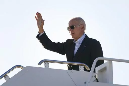 President Joe Biden waves before boarding Air Force One at El Paso International Airport in El Paso, Texas, Sunday, Jan. 8, 2023, to travel to Mexico City, Mexico. The Justice Department is reviewing a batch of potentially classified documents found in the Washington office space of President Joe Biden's former institute, the White House said Monday, Jan. 9. (AP Photo/Andrew Harnik)