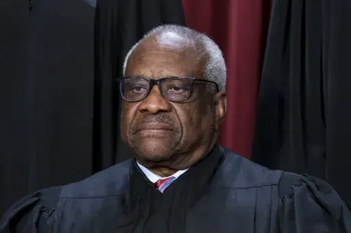 Associate Justice Clarence Thomas joins other members of the Supreme Court as they pose for a new group portrait, at the Supreme Court building in Washington, Oct. 7, 2022. Lawyers who aided former President Donald Trump's efforts to overturn the results of the 2020 election regarded an appeal to Thomas as a "key" to their success. (AP Photo/J. Scott Applewhite, File)